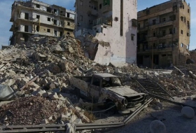 Syrian state TV says army takes key Aleppo district